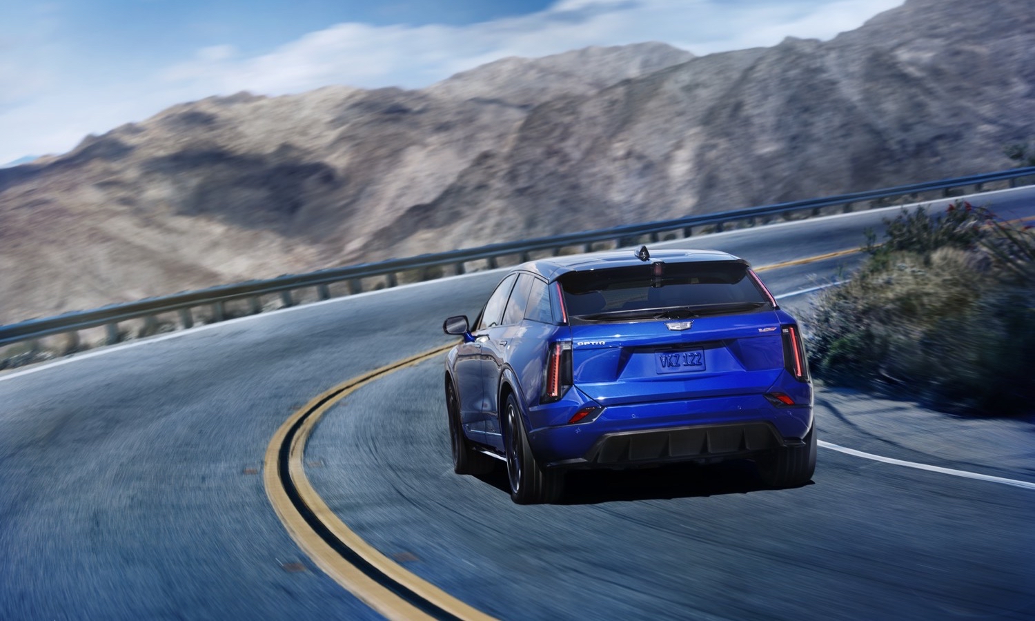 Rear view of the 2026 Cadillac OPTIQ-V in Deep Ocean Tintcoat