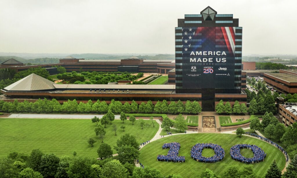 Chrysler officially turns 100 today, June 6, 2025, and the brand is celebrating by recognizing the people who have powered its path to the century mark — a rare accomplishment for any brand or company. More than 1,500 employees came together at the Chrysler Technology Center campus in Auburn Hills, Michigan, on Thursday, June 5 to participate in a special group “birthday” photo honoring the thousands who have worked over the decades to make 100 years of Chrysler possible.
