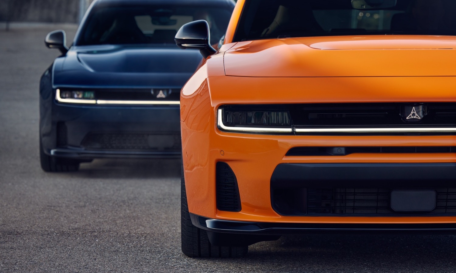 SIXPACK-powered 2026 Dodge Charger Scat Plus in Peel Out (front) and all-electric 2026 Dodge Charger Daytona Scat Pack Plus in Bludicrous (rear).