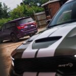 2026 Dodge Durango SRT Hellcat Jailbreak in Green Machine (front). A Jailbreak Custom Color program will allow select Dodge customers to paint their Durango SRT Hellcat Jailbreak in nearly any color imaginable, including Stryker Purple (shown at rear).